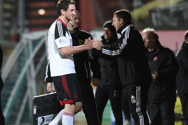 Derek McInnes, right, hails hat-trick hero Scott Vernon after the match against Dundee United. Picture: SNS
