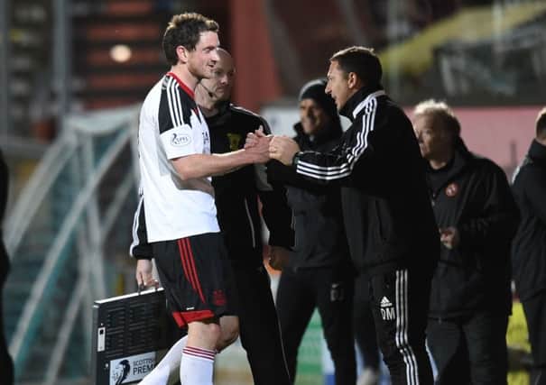 Derek McInnes, right, hails hat-trick hero Scott Vernon after the match against Dundee United. Picture: SNS