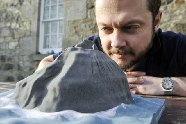 Nick Hancock looks at a model of Rockall as he plans his attempt. Picture: Phil Wilkinson