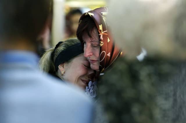 Women in the rebel-held eastern Ukraine city of Slovyansk bury their dead. Picture: AP