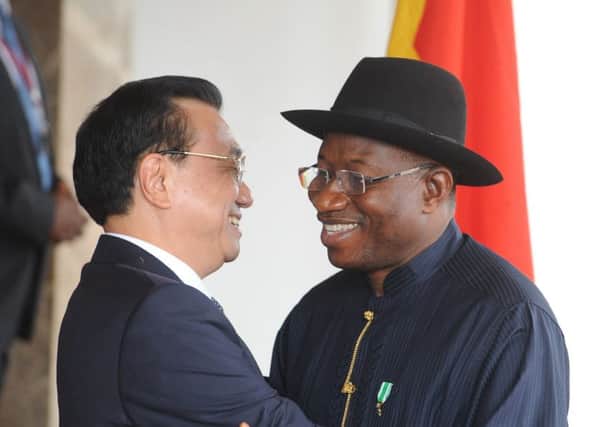 Goodluck Jonathan greets Chinese premier Li Keqiang on his arrival in Abuja yesterday. Picture: AFP