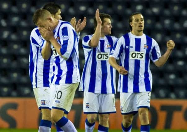 Kilmarnock's Lee Ashcrof (left) joins his team mates in celebrating at full time after earning three points against St Mirren. Picture: SNS