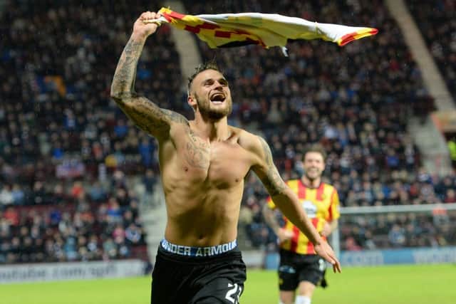 Kallum Higginbotham celebrates after scoring to give Partick a two-goal cushion. Picture: SNS