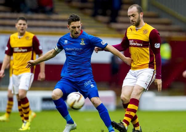 Motherwell's James McFadden (right) clashes with Graeme Shinnie. Picture: SNS