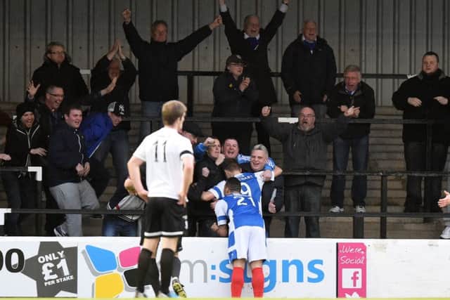 Ayr Utd's Greg Stewart celebrates his goal with the travelling fans. Picture: SNS