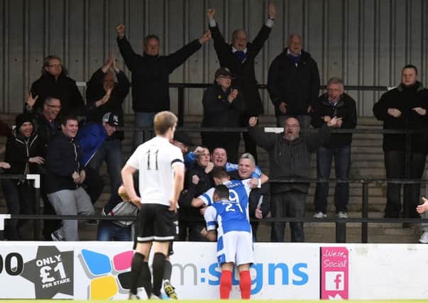 Ayr Utd's Greg Stewart celebrates his goal with the travelling fans. Picture: SNS