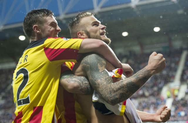 Kallum Higginbotham celebrates after scoring to give Partick a two-goal cushion. Picture: SNS