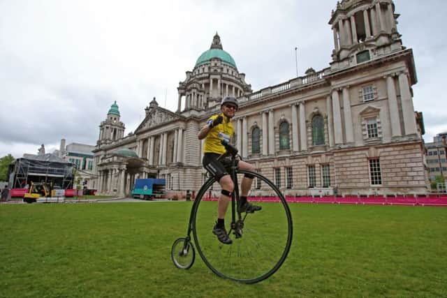 Cyclist Joff Summerfield, who circumnavigated the globe on a penny farthing, at Belfast City Hall. Picture: PA