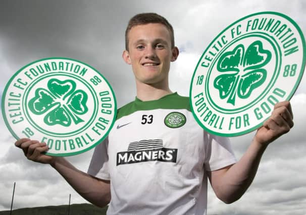 Liam Henderson publicises the Celtic Foundation charity collection against Dundee United. Picture: SNS