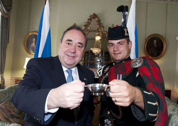 Alex Salmond receives a commemorative Quaich from Lone Piper Cpl Stuart Donald Gillies from The Royal Highland Fusiliers, 2nd Battalion The Royal Regiment of Scotland. Picture: Kenny Smith