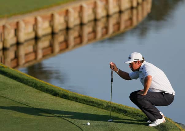 Lee Westwood lines up his putt on the fourth green at TPC Sawgrass. Picture: Kevin C Cox/Getty