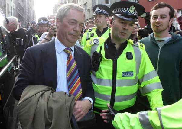 Nigel Farage, Leader of UKIP was demonstrated against by Anti-Racist protesters resulting in him having to be escorted by police into a police van when he was last in Scotland. Picture: HEMEDIA