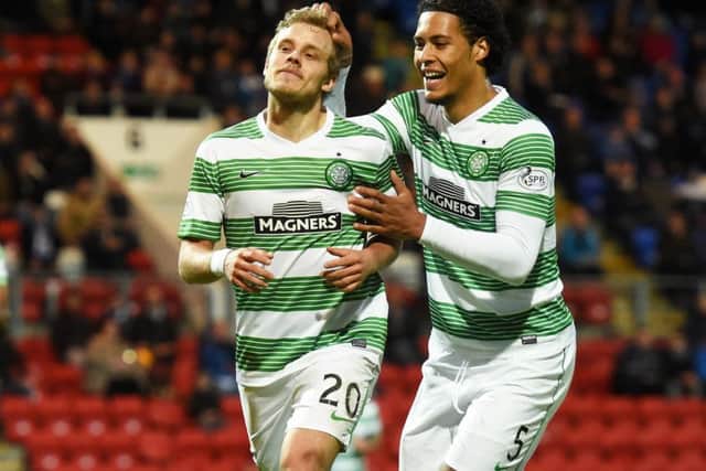 Teemu Pukki celebrates his goal against St Johnstone with team-mate Virgil Van Dijk, the striker is attracting interest from Germany. Picture: SNS