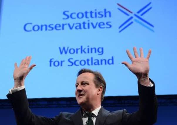 Holding his hands up but David Cameron won't quit should a Yes vote be secured in the coming election. Picture: Neil Hanna