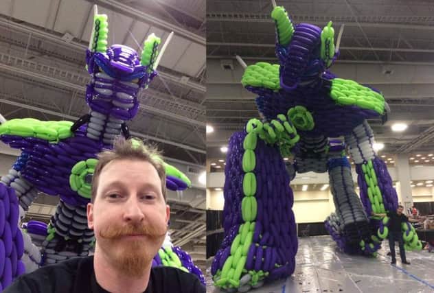 Poptastic: John Reid poses with 'Poptimus Prime', left, and the sculpture in all its glory, right. Pictures: Submitted