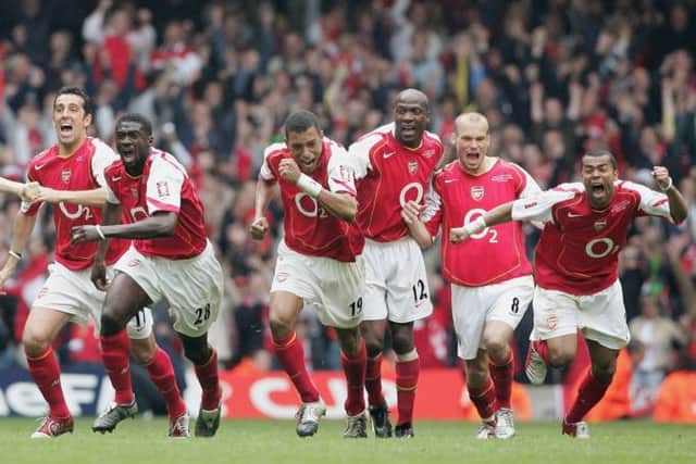 Arsene Wenger says trophies arent the only measure of progress but was happy enough to win one in 2005. Picture: Getty