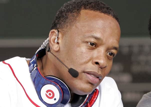 Dr Dre sports a pair of the distinctive headphones. Picture: Reuters