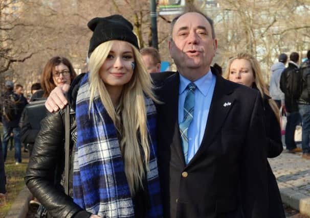 Alex Salmond walks with Scottish singer Nina Nesbitt in New York. Picture: Getty