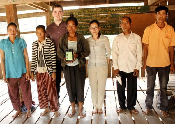 Neil Stewart with Cambodians helping him to develop and test out the technology. Picture: Contributed