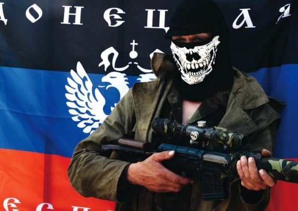 A pro-Russian fighter stands at a checkpoint near Slaviansk. Picture: Getty