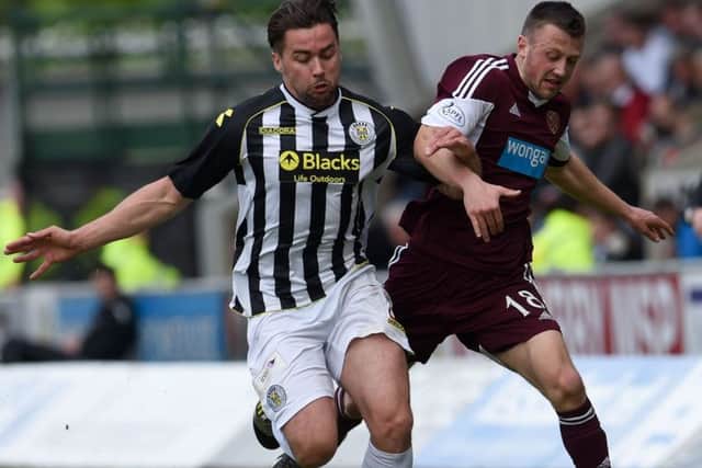 St Mirren's Darren McGregor goes toe to toe with Dale Carrick. Picture: SNS