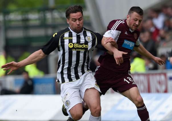 St Mirren's Darren McGregor goes toe to toe with Dale Carrick. Picture: SNS