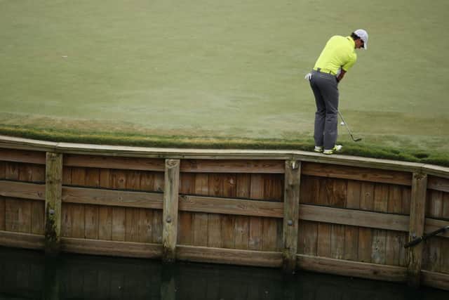 Rory McIlroy chips on the 17th green. Picture: Getty