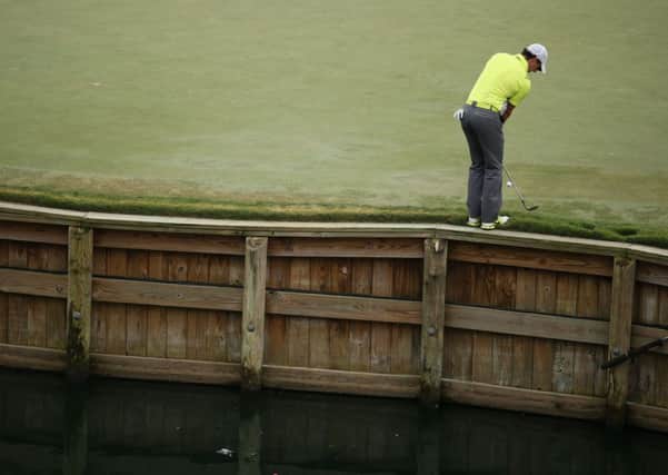 Rory McIlroy chips on the 17th green. Picture: Getty