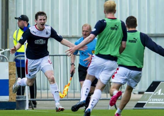Falkirks Blair Alston rushes to celebrate after scoring the winner against Queen of the South. Picture: SNS