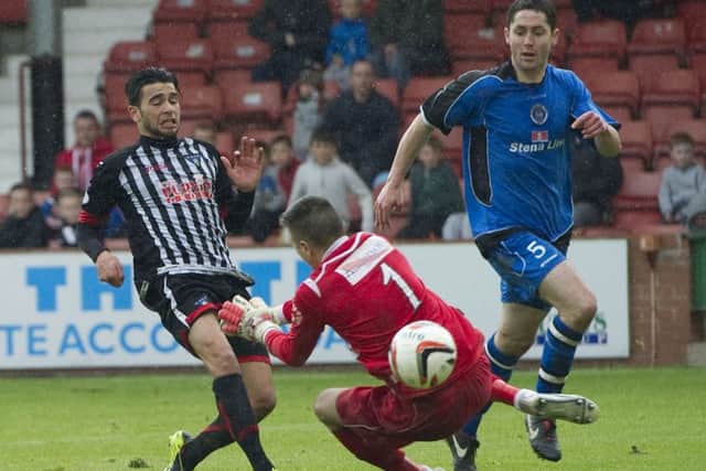 Faissal El Bakhtaoui scores to give Dunfermline a three-goal lead. Picture: SNS