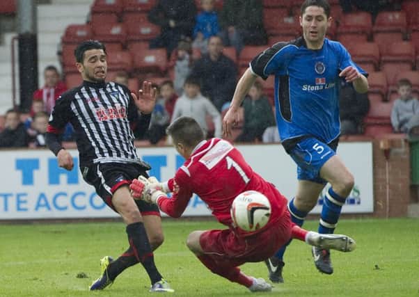 Faissal El Bakhtaoui scores to give Dunfermline a three-goal lead. Picture: SNS