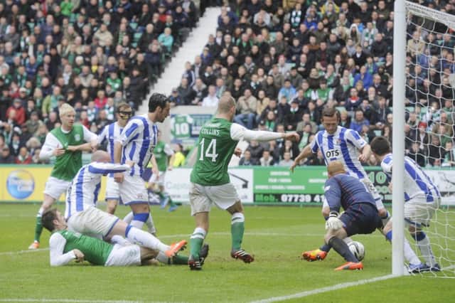 Kilmarnock defender Sammy Clingan clears the danger as one of numerous Hibs chances goes begging. Picture: Greg  Macvean