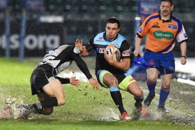 Glasgows Lee Jones splashes his way along the touchline during Saturdays comfortable win over Zebre. Picture: SNS Group/SRU