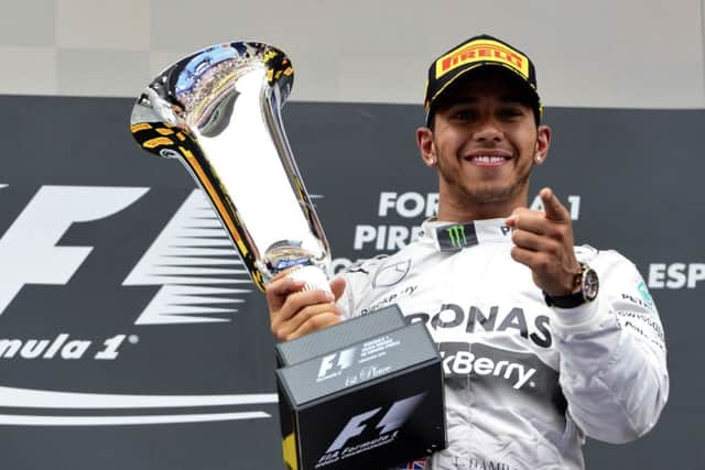 Mercedes driver Lewis Hamilton celebrates after winning the Spanish Grand Prix for his fourth victory in a row. Picture: AFP/Getty