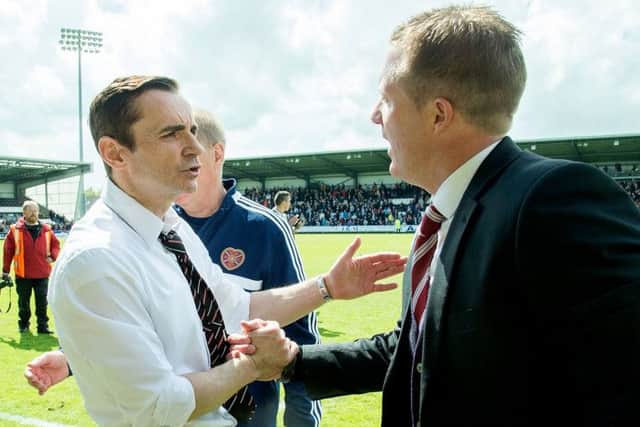 St Mirren manager Danny Lennon, left, and his Hearts counterpart Gary Locke embrace at full-time. Picture: SNS