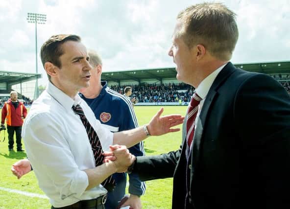 St Mirren manager Danny Lennon, left, and his Hearts counterpart Gary Locke embrace at full-time. Picture: SNS