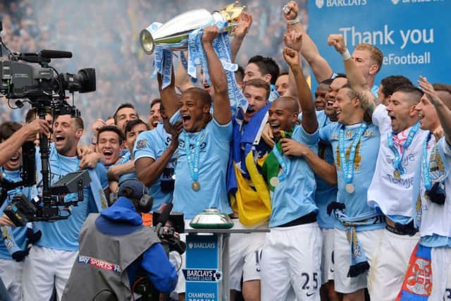 Manchester City skipper Vincent Kompany lifts the Barclays Premier League trophy. Picture: Getty