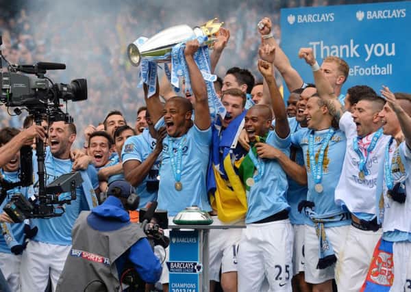 Manchester City skipper Vincent Kompany lifts the Barclays Premier League trophy. Picture: Getty
