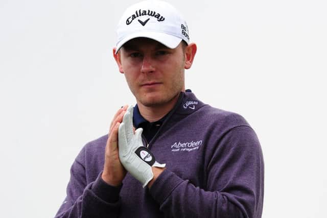 Scott Henrys sombre look summed up the mood of players following the death of caddie Iain McGregor. Picture: Getty