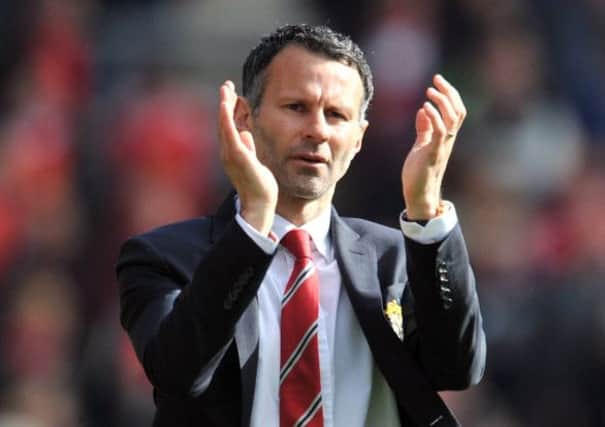 Ryan Giggs thanks the fans after what was likely to be his final game in charge of Manchester United. Picture: AFP/Getty