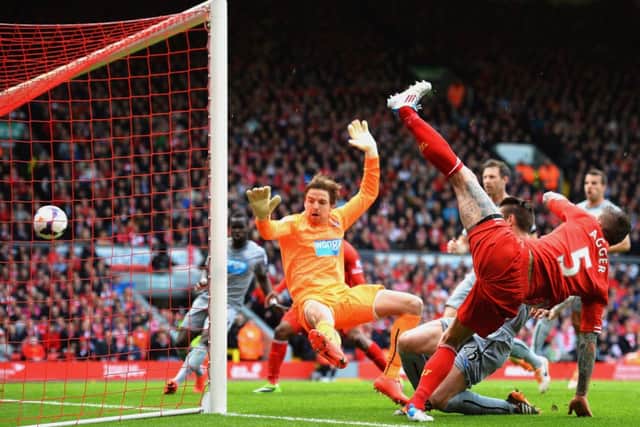 Daniel Agger cancels out Newcastles opening goal by diverting the ball past Tim Krul from close range. Picture: Getty