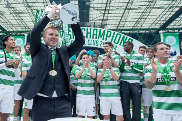 Neil Lennon lifts the SPFL Premiership trophy. Picture: Kenny Ramsay