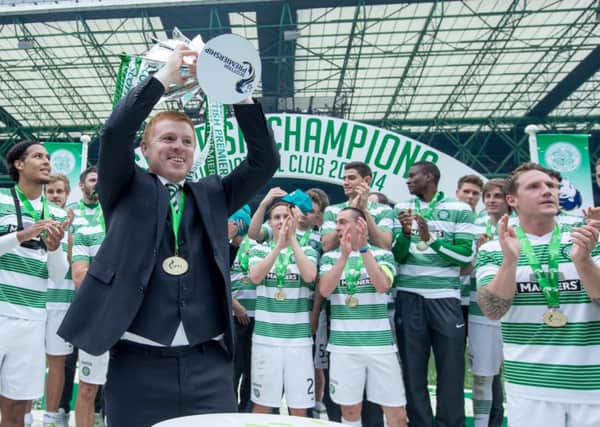 Neil Lennon lifts the SPFL Premiership trophy. Picture: Kenny Ramsay