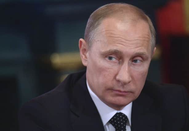 Alex Salmond said it was a good thing Putin had substantially restored Russian pride. Picture: AP
