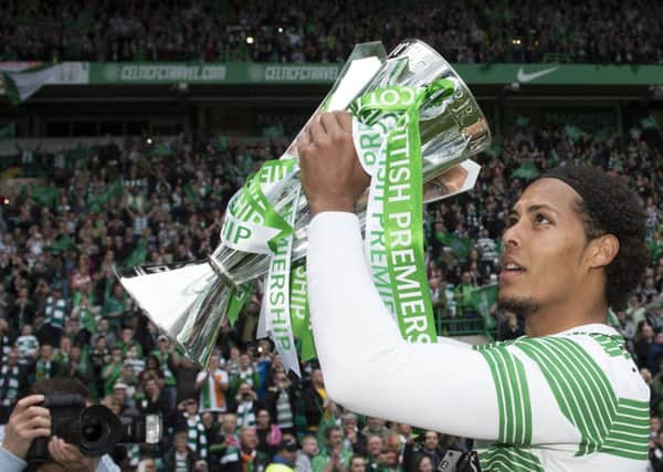 Celtic's Virgil Van Dijk celebrates with the Scottish Premiership trophy. Picture: SNS