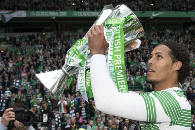 Celtic's Virgil Van Dijk celebrates with the Scottish Premiership trophy. Picture: SNS