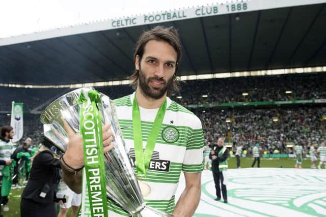 Georgios Samaras celebrates winning the title with Celtic but has revealed he didn't want to leave. Picture: SNS
