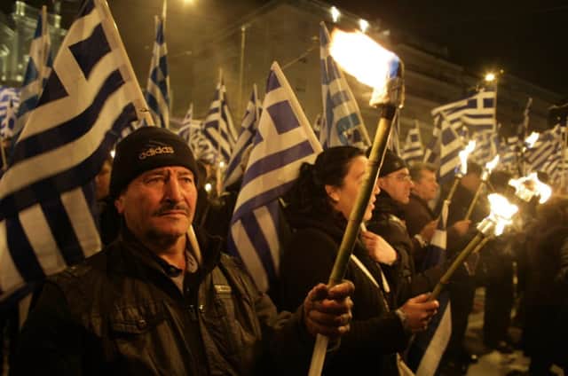 Members of Golden Dawn demonstrate against the arrest of six of the partys MPs. Picture: Getty