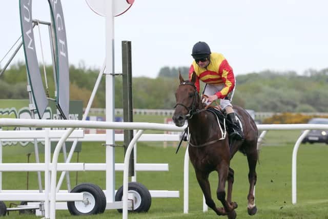 7-2 favourite Sir Guy Porteous, ridden by Joe Fanning, wins at Musselburgh yesterday. Picture: John Grossick