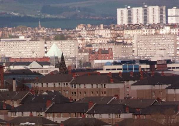 Police are hunting three men over the rape of a woman who was dragged into a close as she walked along a street in Glasgow's Toryglen. Picture: TSPL